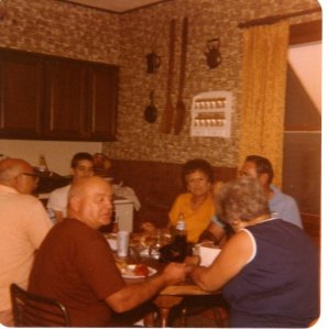 A gathering of family at the kitchen table. The kitchen at the farm was always busy.